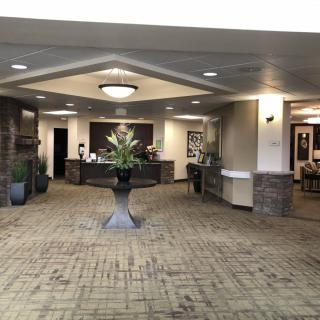 A welcoming reception area with elegant interior decor and a central floral arrangement.