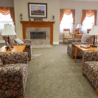 A cozy living room with comfortable sofas and a fireplace.