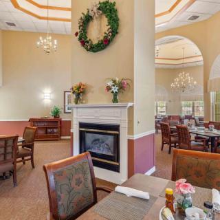 An elegant dining area featuring a cozy fireplace and stylish decor.