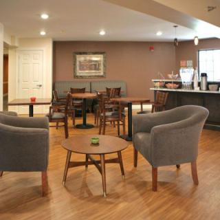A cozy cafe with modern seating arrangements and a warm ambiance.