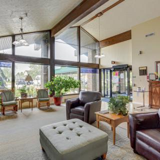A welcoming lobby featuring comfortable seating and plenty of natural light.