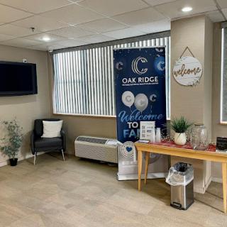A welcoming lobby area featuring comfortable seating, decorative elements, and a prominent welcome banner.