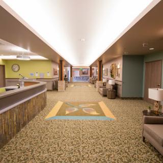 A modern hotel lobby featuring a spacious reception area with comfortable seating and stylish decor.