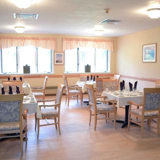 A cozy restaurant dining area with neatly arranged tables and chairs.