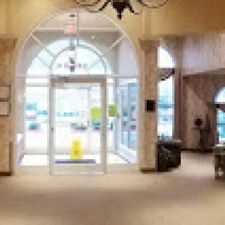 A spacious and inviting lobby with a grand entrance and elegant decor.