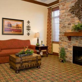Cozy living room with a stone fireplace and elegant decor.