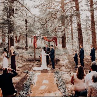 A beautiful outdoor wedding ceremony surrounded by nature.