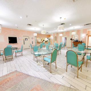 A bright and inviting dining room with pastel-colored decor.