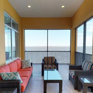 A cozy balcony with comfortable seating and a stunning ocean view.