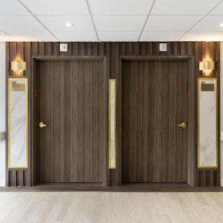 Elevator doors in a modern interior hallway.