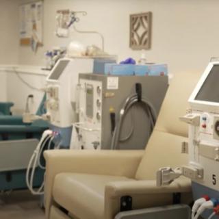 A dialysis clinic equipped with medical machines and patient chairs.