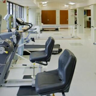 A well-equipped gym with various exercise machines.