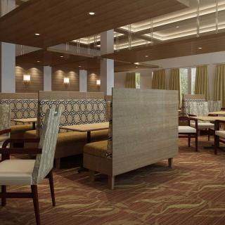A modern restaurant interior featuring lined-up booths and chairs with ambient lighting.
