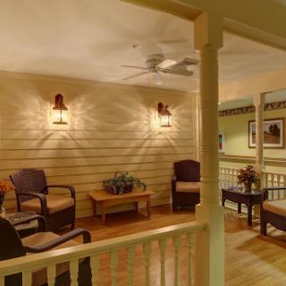 A cozy seating area featuring comfortable chairs and warm lighting, perfect for relaxation.