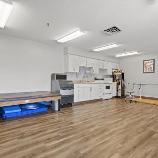 A bright and spacious physical therapy clinic equipped for rehabilitation.