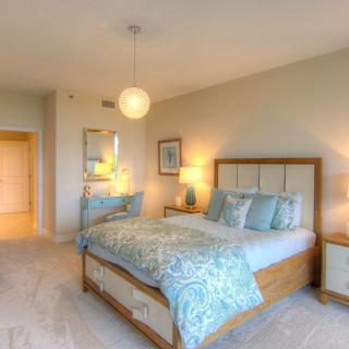 A bright and modern bedroom with stylish decor and cozy furnishings.