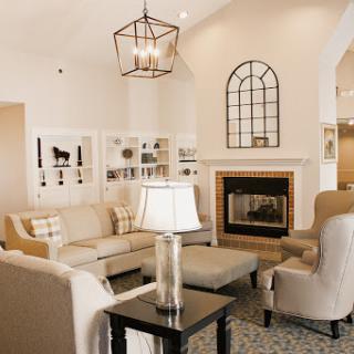 A beautifully designed living room featuring a cozy arrangement with a fireplace and stylish decor.
