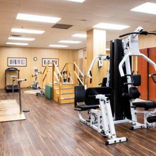 A well-equipped gym with various fitness machines for exercise.