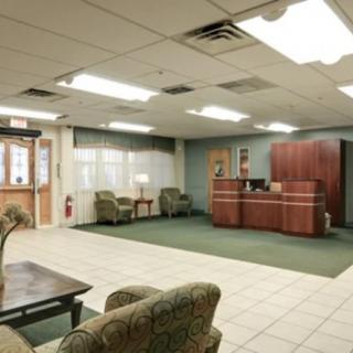 A spacious reception area with seating and a front desk.