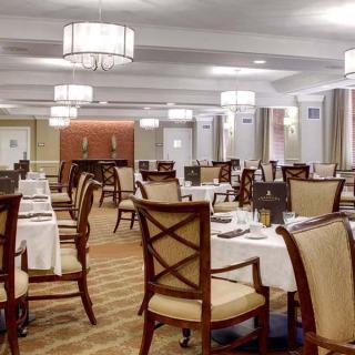 Elegant dining area with neatly arranged tables and chairs.