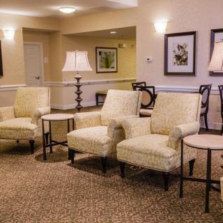 A cozy waiting room with comfortable chairs and elegant decor.