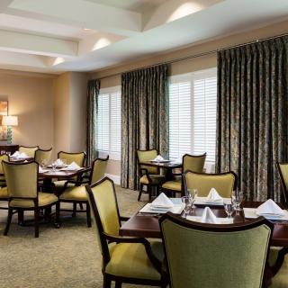 Elegant dining area with neatly arranged tables and chairs.