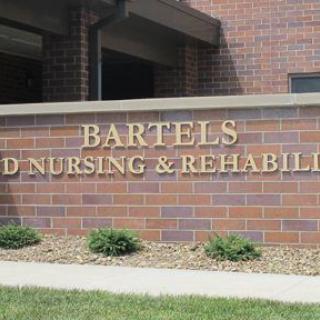 A brick sign displaying 'Bartels' associated with a nursing and rehabilitation facility.