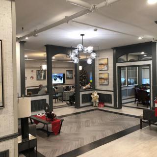 A spacious and elegantly decorated lobby area with modern furnishings and lighting.