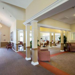 Spacious lobby interior with comfortable seating and decorative columns.