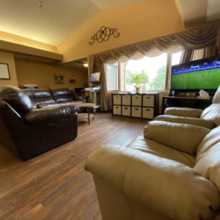 Cozy living room with comfortable seating and a large TV.