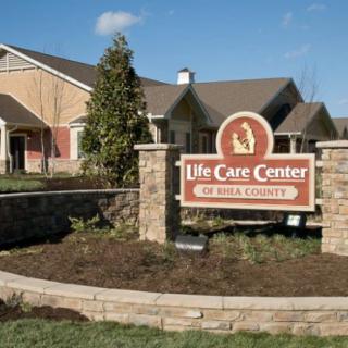 Exterior view of a nursing home with a prominent sign reading 'Life Care Center.'