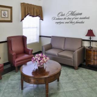 A cozy waiting room with comfortable seating and decorative accents.