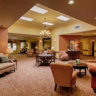 A cozy lounge area with comfortable seating and warm lighting.