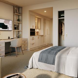 A modern minimalist bedroom with a cozy bed, workspace, and neutral decor.