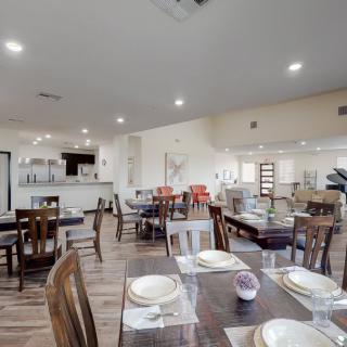 A cozy restaurant dining area with tables set for guests.