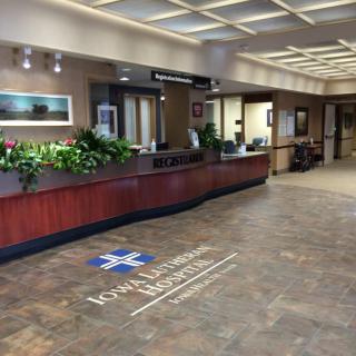 A hospital lobby with a reception and information desk.