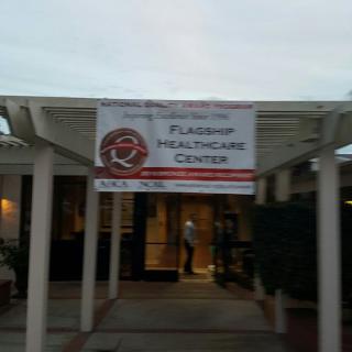 Entrance to a healthcare center with a banner overhead.