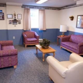 A cozy living room with comfortable seating arrangements and a central coffee table.