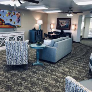 A well-decorated living room with comfortable seating and stylish decor.