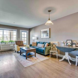 A modern living room with a cozy seating area and dining space.