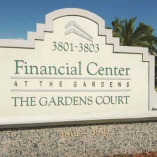 A sign for the Financial Center at The Gardens Court.
