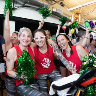 A lively spin class celebrating fitness with cheer and camaraderie.