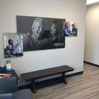 A cozy waiting area featuring a bench and engaging wall art.