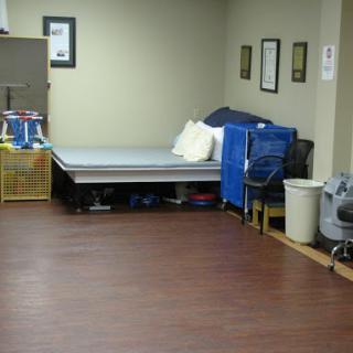 A cozy room featuring a bed and various storage items, ideal for relaxation or work.