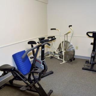 A small indoor gym area featuring exercise bikes and fitness equipment.