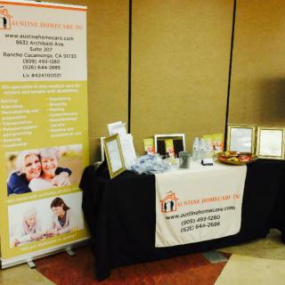 A healthcare booth at a conference showcasing promotional materials and informational displays.