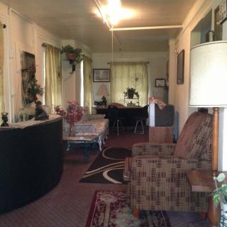A vintage-style living room with classic furniture and decor.
