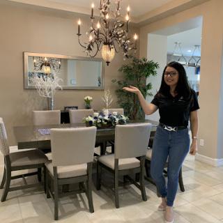 A beautifully designed dining room with elegant lighting and stylish furniture.