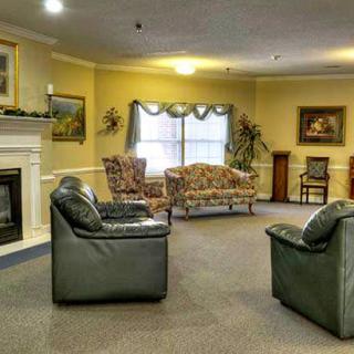 A cozy living room with comfortable seating and a fireplace.