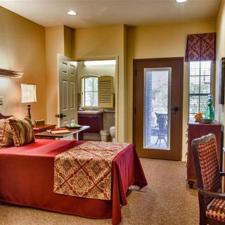 A cozy bedroom with warm lighting and elegant decor.